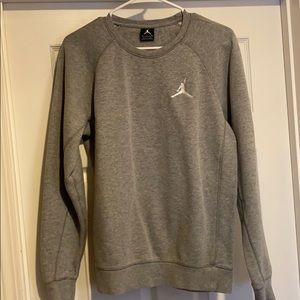 Grey Jordan sweatshirt.